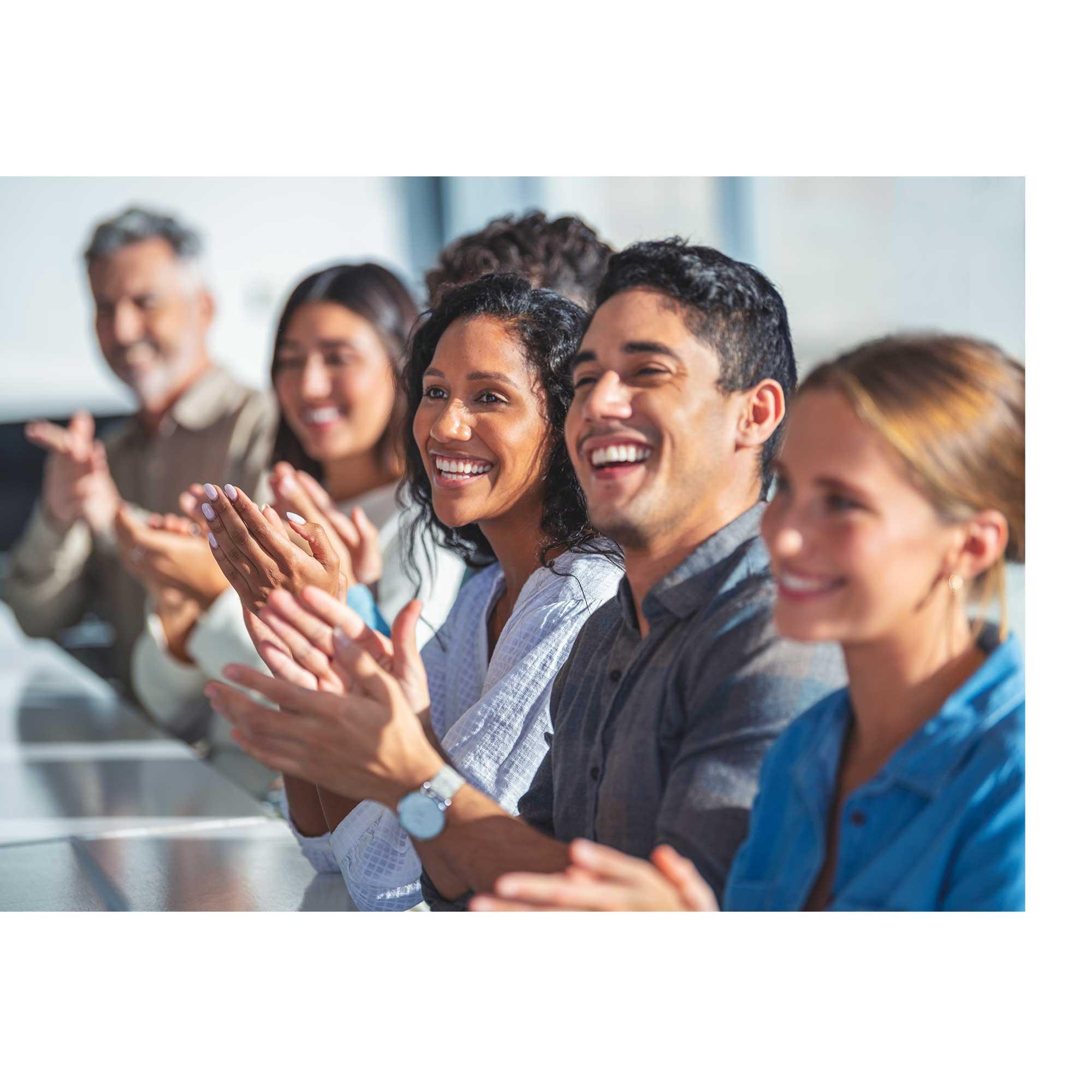 CentralSquare employees clapping during a meeting