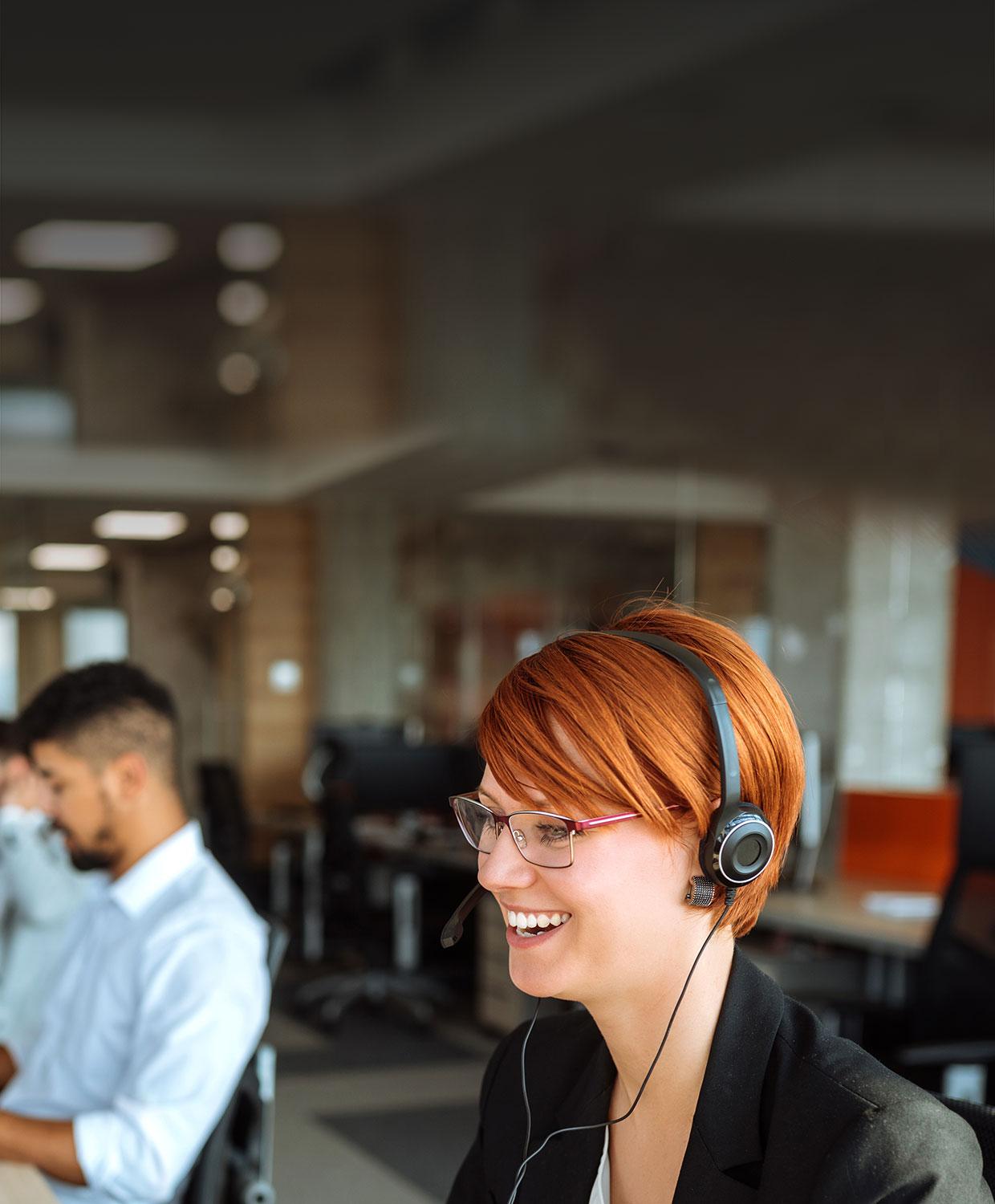 CentralSquare customer service expert speaking through headset to prospective customer about CentralSquare public safety & public administration software