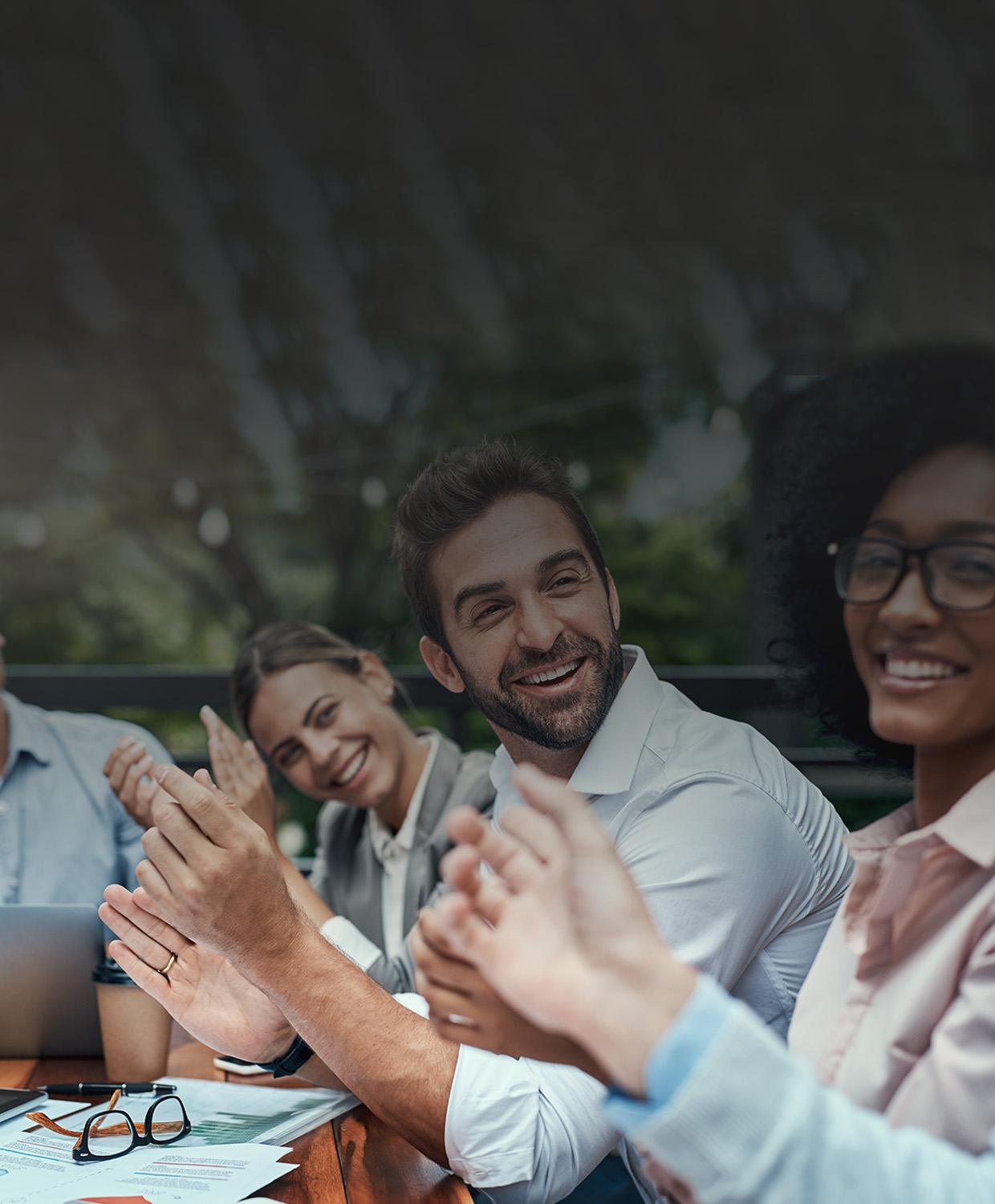 CentralSquare employees smiling during a meeting